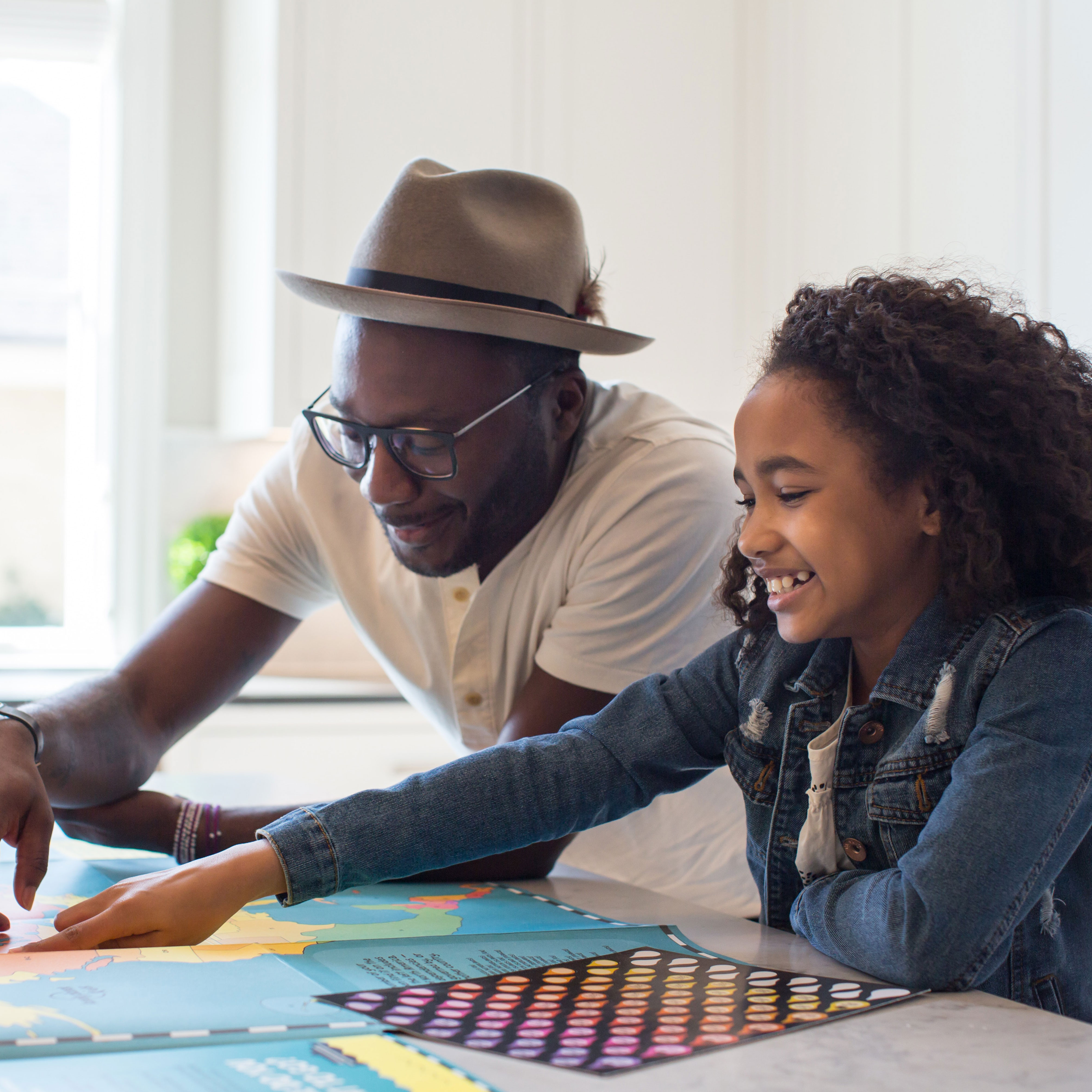 Father helping daughter with homework